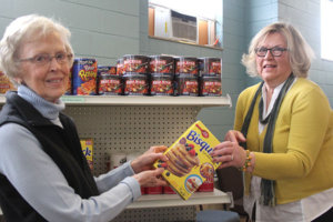 Tiffany Krupke/Albert Lea Tribune Dorothy Simonsen, left, and Betty Buffington help stock the Ecumenical Food Shelf.